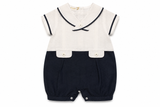 Pagliaccetto Bimbalò da neonato bianco e blu navy con colletto marinaretto, maniche corte e taschine decorative